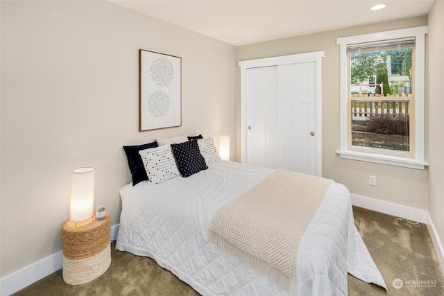 carpeted bedroom featuring a closet