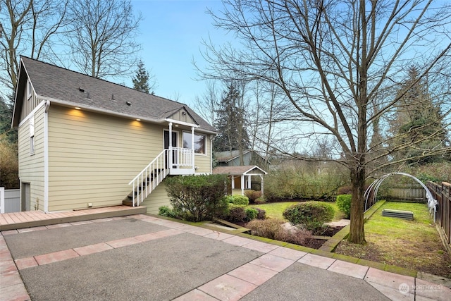 view of front facade featuring a front yard and a patio