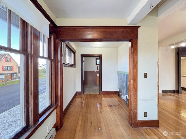 hall with light wood-type flooring