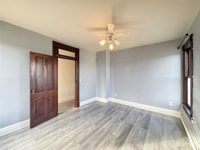 unfurnished bedroom with light hardwood / wood-style flooring and ceiling fan