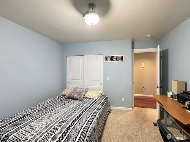 carpeted bedroom featuring a closet