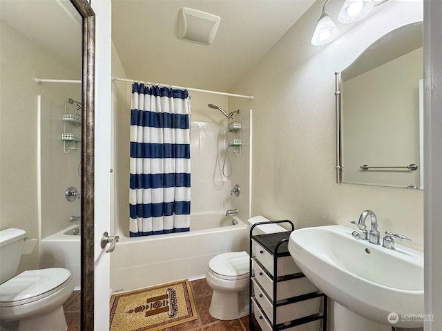 full bathroom featuring toilet, shower / bath combo, and sink