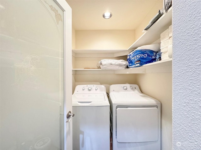 washroom featuring washer and clothes dryer