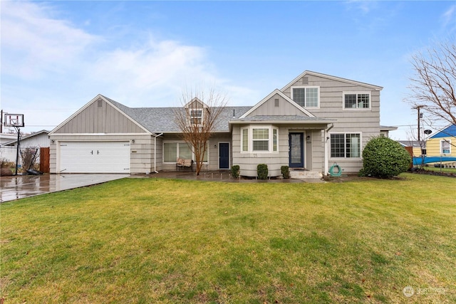 view of front of home featuring a front lawn and a garage