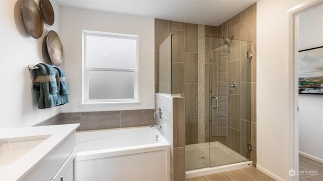 bathroom featuring vanity and plus walk in shower