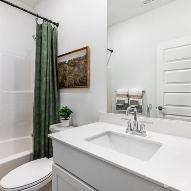 full bathroom with vanity, shower / bathtub combination with curtain, and toilet