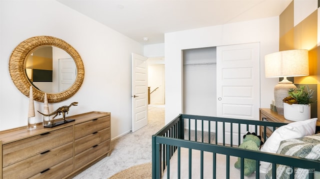 carpeted bedroom with a closet