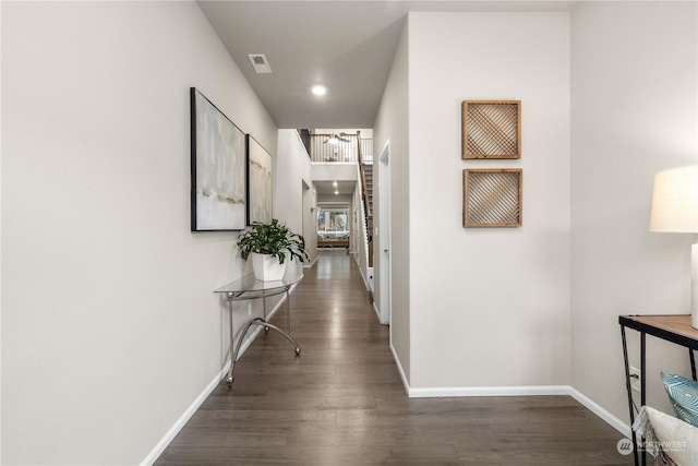 hallway featuring dark hardwood / wood-style flooring