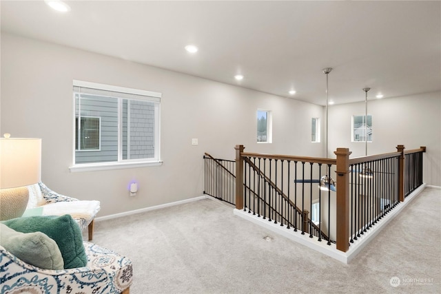 living area with light colored carpet