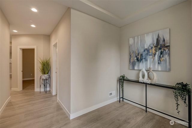 hall with light hardwood / wood-style flooring