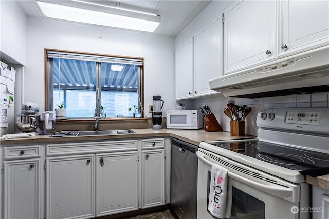 kitchen with white cabinetry, sink, and white appliances