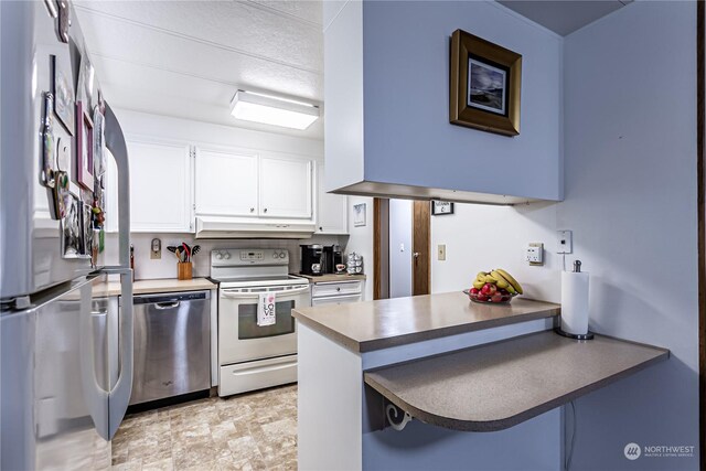 kitchen with white cabinetry, appliances with stainless steel finishes, and kitchen peninsula