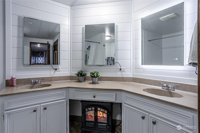 bathroom with vanity and wood walls