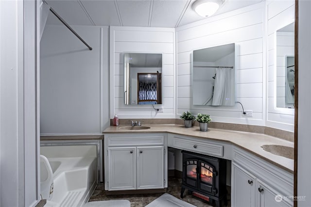 bathroom with vanity and wooden walls