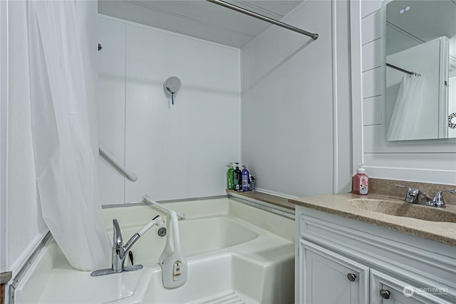 bathroom featuring vanity and a bathtub