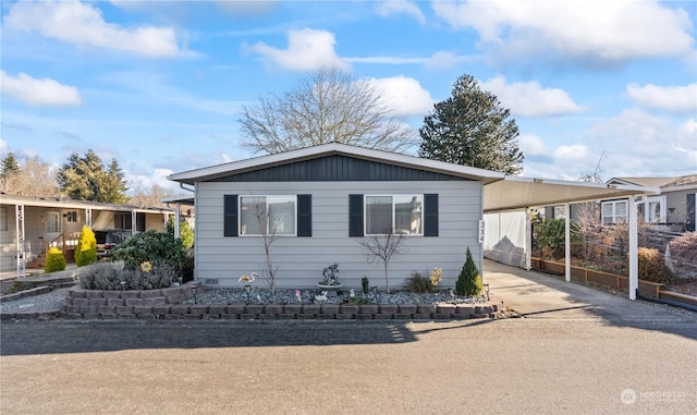 view of front of home with a carport