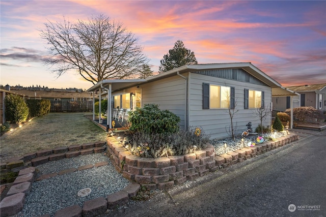 view of property exterior at dusk