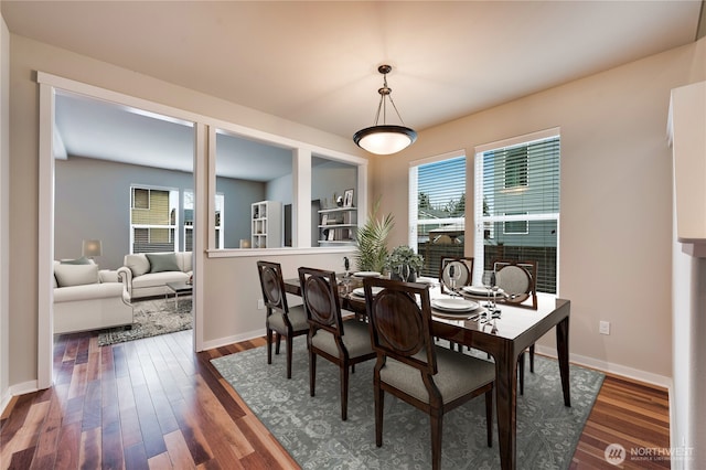 dining space featuring dark hardwood / wood-style floors