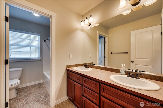 full bathroom featuring shower / bath combination, vanity, and toilet