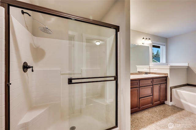 bathroom featuring shower with separate bathtub and vanity