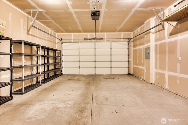 garage featuring a garage door opener and electric panel