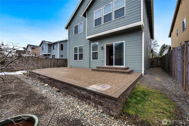 rear view of property featuring a patio area