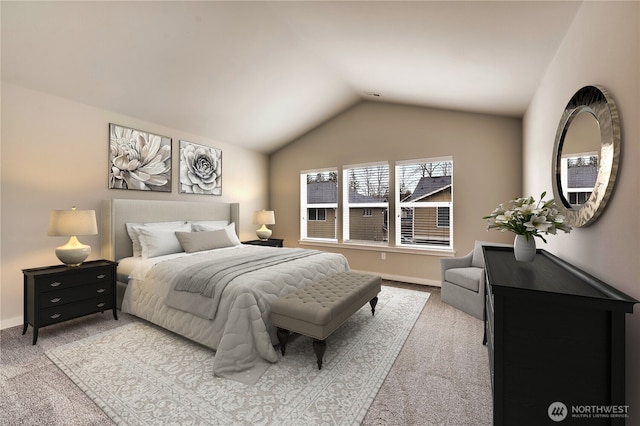 bedroom with vaulted ceiling and light colored carpet