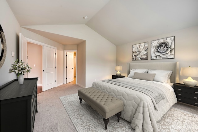 carpeted bedroom with vaulted ceiling