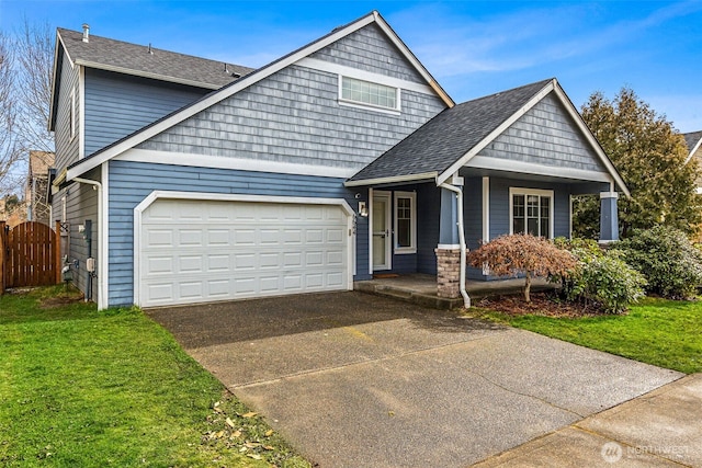 craftsman house with a front lawn, a porch, and a garage