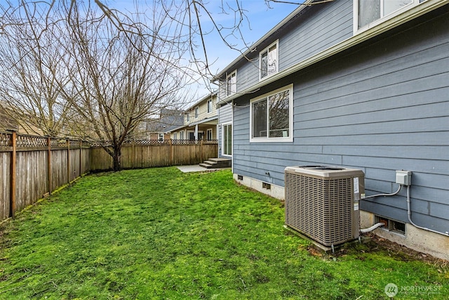 view of yard with central air condition unit