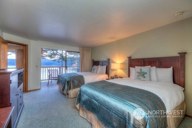 bedroom featuring access to outside and light colored carpet