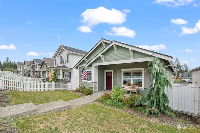 view of front of property with a porch and a front lawn