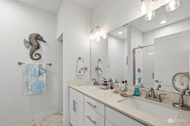 bathroom featuring an enclosed shower and vanity