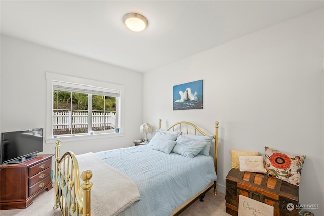 bedroom featuring light colored carpet