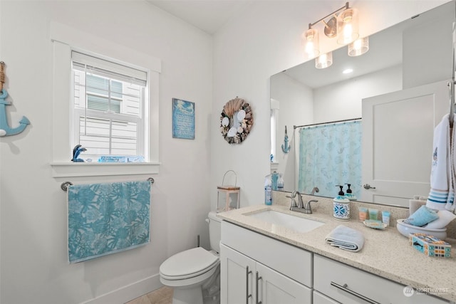 bathroom with a shower with shower curtain, vanity, and toilet