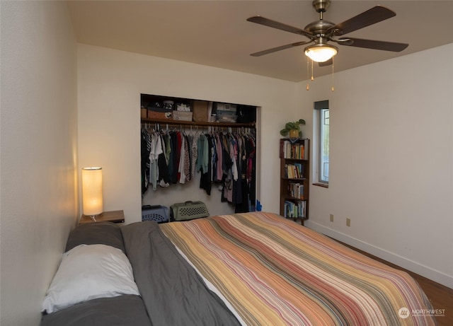 bedroom featuring ceiling fan, hardwood / wood-style floors, and a closet