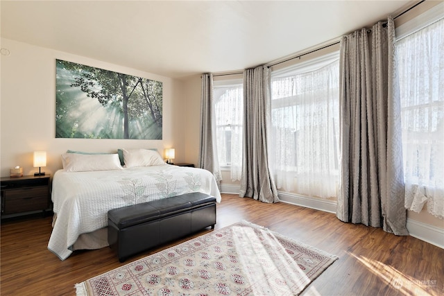 bedroom with hardwood / wood-style flooring