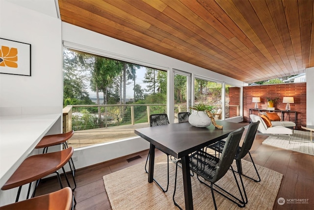 sunroom / solarium featuring wooden ceiling