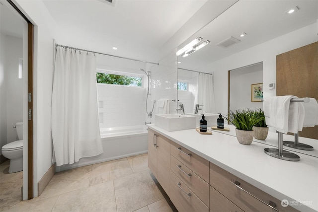 full bathroom with toilet, tile patterned flooring, shower / tub combo, and vanity