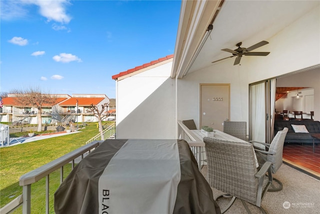 exterior space featuring a balcony, ceiling fan, and a grill