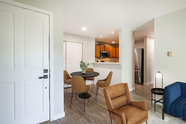 dining room featuring light hardwood / wood-style flooring