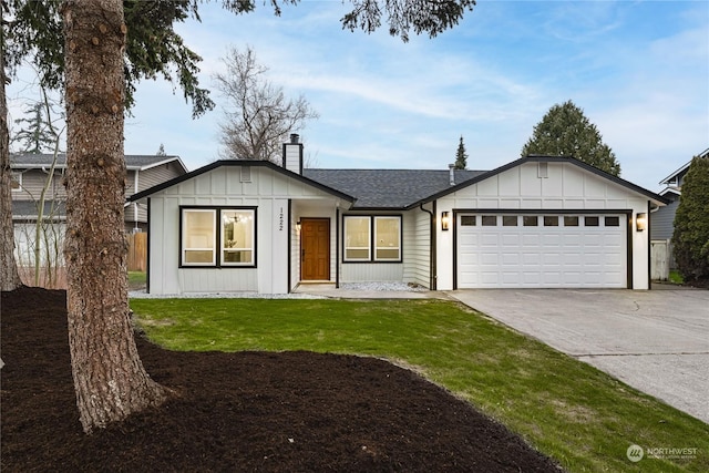 single story home with a garage and a front lawn