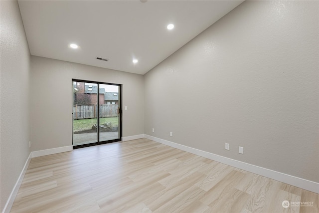 unfurnished room with light hardwood / wood-style flooring