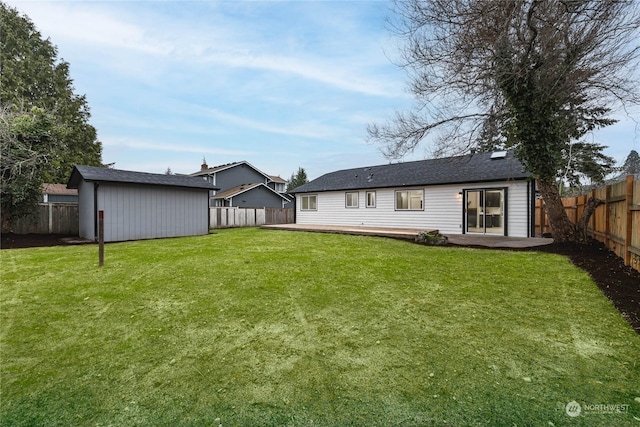 back of house with a patio area and a yard