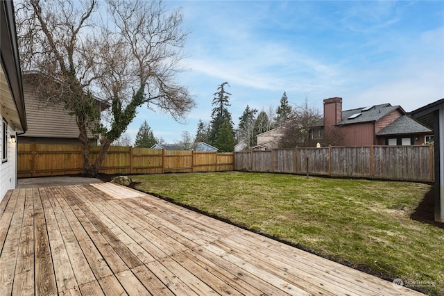 wooden deck featuring a yard