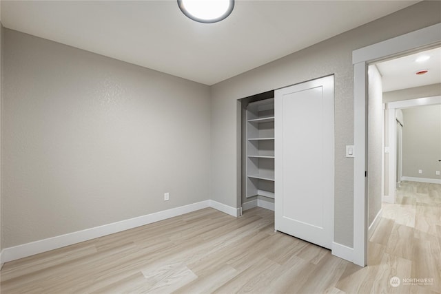 unfurnished bedroom with light wood-type flooring