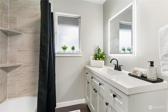 bathroom featuring shower / bath combination with curtain and vanity