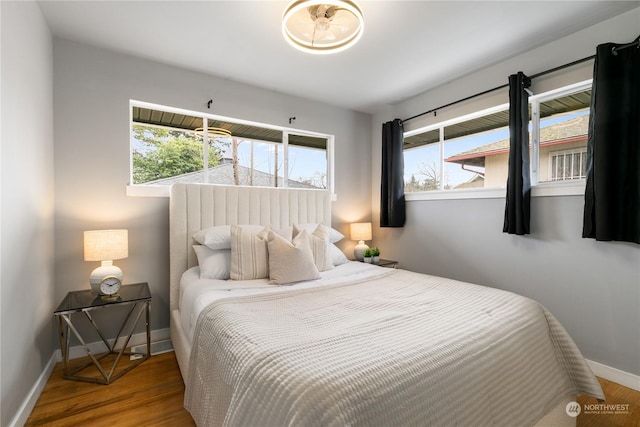 bedroom with wood-type flooring