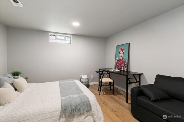 bedroom with hardwood / wood-style flooring