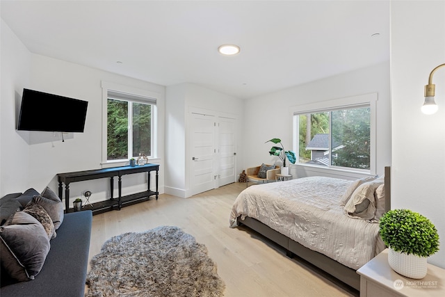 bedroom with light hardwood / wood-style floors